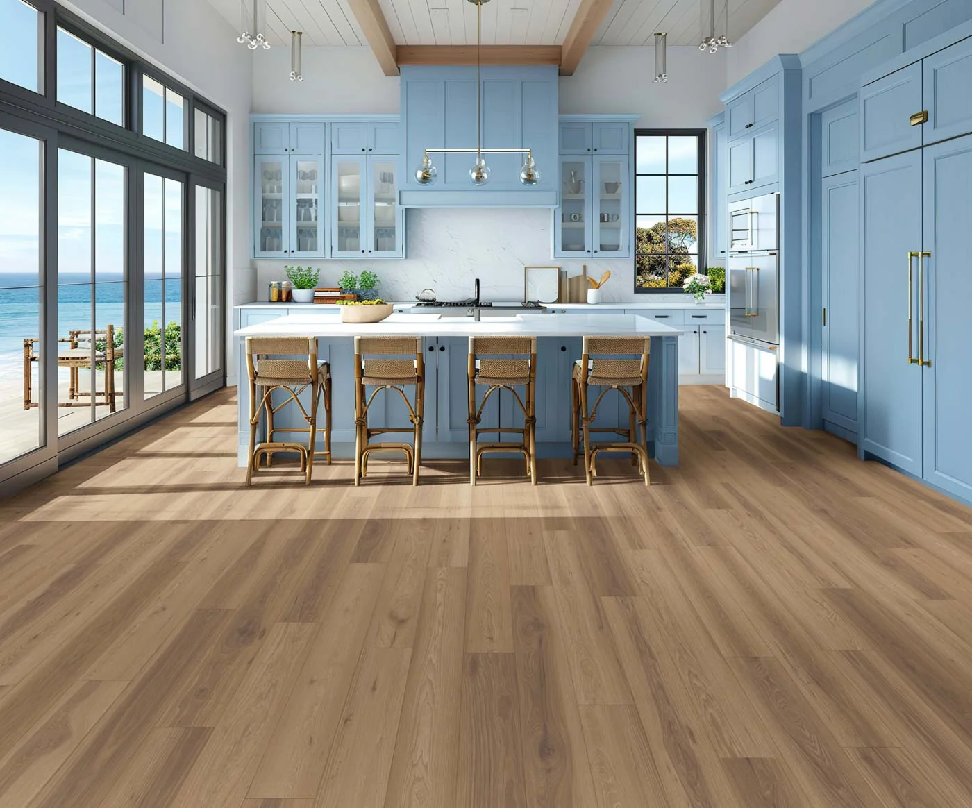 A blue kitchen with a large island and warm oak plank flooring